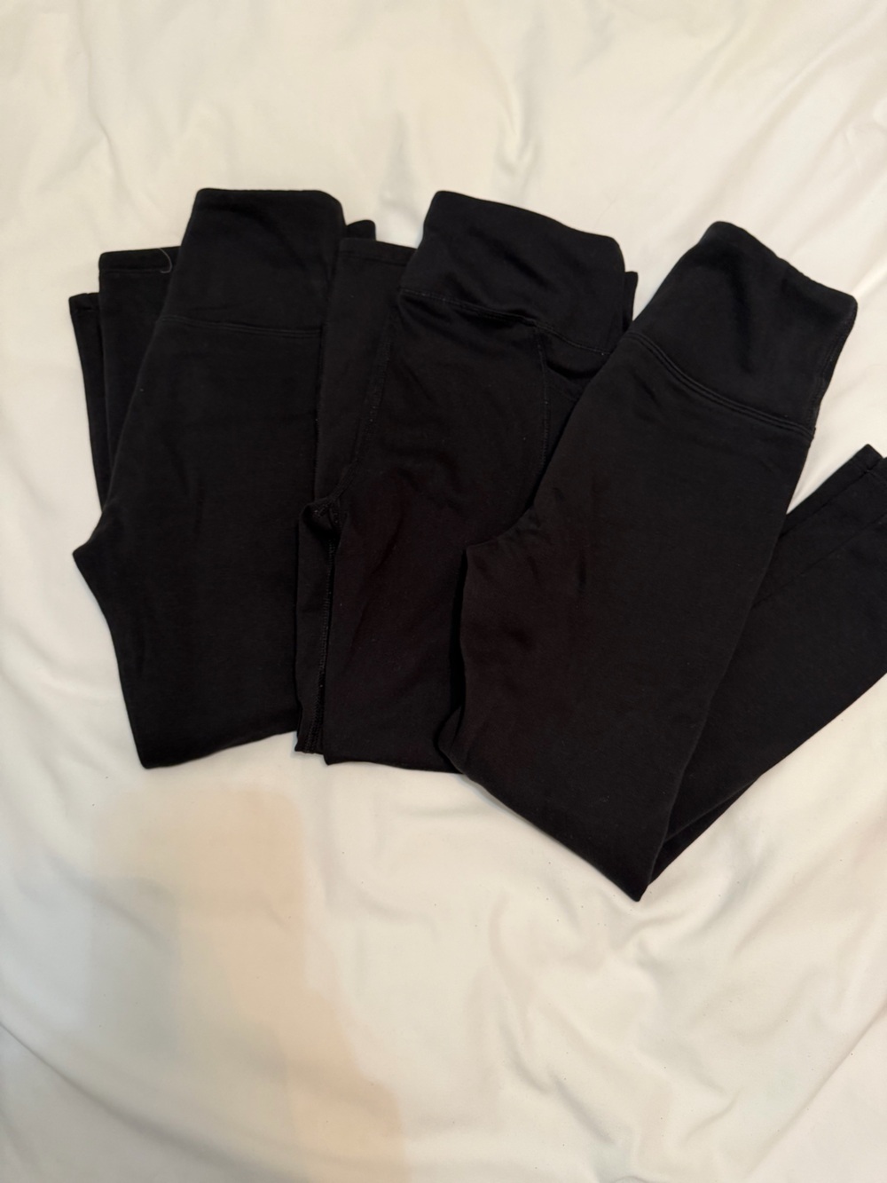 Three black leggings